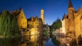 View of the Belfort and one of the canals of Bruges at night (Belgium)