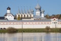 View of the belfry of the ancient Tikhvin Assumption Monastery from the side of Tabory lake Royalty Free Stock Photo