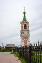 Bell tower with golden dome, cross and bells in Cherepanovo, Russia