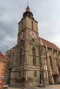 View of the bell tower of the historic gothic Black Church in the city of Brasov. Transylvania. Romania Royalty Free Stock Photo