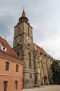 View of the bell tower of the historic gothic Black Church in the city of Brasov. Transylvania. Romania Royalty Free Stock Photo