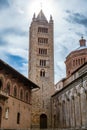 View of the bell tower of Massa Marittima in Tuscany with the sun in the background Royalty Free Stock Photo