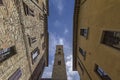 View of the bell tower of Volterra through the streets of the city Royalty Free Stock Photo