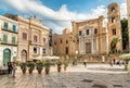 View of Bellini Square with tourists visiting the Santa Maria dell`Ammiraglio Church known as Martorana Church in Palermo.