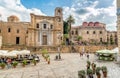 View of Bellini Square with tourists visiting the Santa Maria dell`Ammiraglio Church and San Cataldo Church.