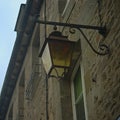 View from bellow on lantern on stone wall with windows Royalty Free Stock Photo