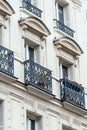 View from below on a facade European building with balconies in Paris Royalty Free Stock Photo