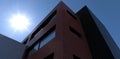 View from below on the facade of a modern office building. Exterior finishes are a combination of black, red and white bricks. Royalty Free Stock Photo