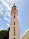 View from below of mosque minaret in Dahab on the Sinai Peninsula. Minaret detail under blue sky. Islamic culture and religions. Royalty Free Stock Photo