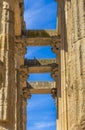 View from below of the rowed marble and granite columns of the Roman temple of Diana with doves perched on its beams. Merida, Royalty Free Stock Photo