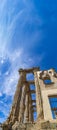 View from below of the side part of the Roman temple of Diana with marble columns and the balcony of the palace of the Count of Royalty Free Stock Photo