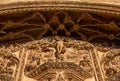 View from below of statue of Jesus Christ in bas-relief and the ornaments of the arch and cornice of the main door with bas-