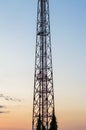 View from below on a telecommunications tower against a blue sky Royalty Free Stock Photo