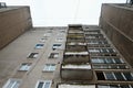 View from below to soviet concrete apartment building with windows and balconies Royalty Free Stock Photo