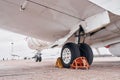 View from below. Turboprop aircraft parked on the runway at daytime