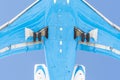 View from below under the flying airplane before landing, in detail chassis, wings, flaps, fuselage and engine Royalty Free Stock Photo