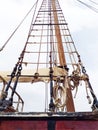 View from below of wooden mast and rigging of Old abandoned wodden traditional fishing boat. Nautical and navigation concept Royalty Free Stock Photo