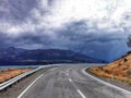 A view on the Ben Ohau range from state highway on the South Island of New Zealand on a rainy cloudy day