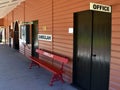 A view of the bench for awaiting trains on the platform of a vintage railway station Royalty Free Stock Photo