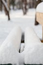 View of a bench in winter park Royalty Free Stock Photo