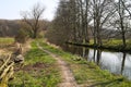 View beyond bare trees on river Schwalm in spring, Germany, BrÃÂ¼ggen Royalty Free Stock Photo