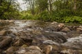 A view of Bieszczady Mountains, Poland, Europe - a stream and some; water and stones. Royalty Free Stock Photo