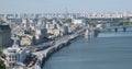 View of the big city. Wide road with moving cars. The sky, high-rise buildings, a wide river with bridges. Kyiv, Ukraine Royalty Free Stock Photo