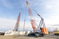 View of the big crawler crane is working in the consruction field. Royalty Free Stock Photo