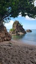 view of the big rock on the red granite sand beach Royalty Free Stock Photo