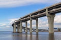 View of the big rounded motorway highway bridge, the road passing over the sea coast of the city. Saint Petersburg,