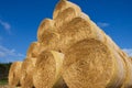 Big stacked round bales of straw, summer, blue sky Czech Republic. Royalty Free Stock Photo