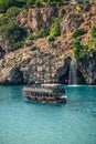 View of big waterfall at Mediterranean seacoast cliff and beach near Antalya, Turkey, summer Royalty Free Stock Photo