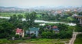 View of the Binh village with river, green grass, cloudy sky