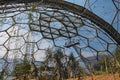 A view of a biome at the Eden Project in Cornwall, England. A maintenance platform is visible and the surrounding hillside is in Royalty Free Stock Photo