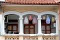 View of bird cages with colorful covers in a shophouse balcony, Jalan Besar, Singapore