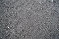 A view of the black dark fertile loose fresh cracked natural moist soil. The background. Texture Royalty Free Stock Photo