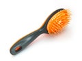 View of black plastic hairbrush with orange bristles isolated on white background. Black rubber massage comb for wet hair. Beauty Royalty Free Stock Photo