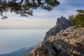 View of the Black Sea from the Crimean mountain Ai Petri. On the left is a fragment of pine. To the right of the rock massif. Plac Royalty Free Stock Photo