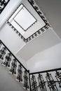 VIew of a black and white staircase, perspective on stairs from below