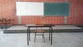 View of a blackboard and whiteboard and an emoty teachers desk. Royalty Free Stock Photo