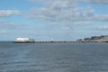 View of blackpool North pier at high tide with town buildings