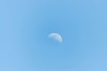 View of blue bright sky with moon in daylight Royalty Free Stock Photo