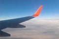 View of the blue clear sky from the height of flight above the clouds from the window of the plane in the bright sun Royalty Free Stock Photo