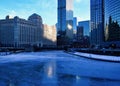 View of a blue and frigid winter morning in Chicago reflecting on a frozen Chicago River. Royalty Free Stock Photo