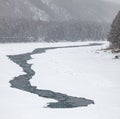 view of a blue and green river katun with snow and crushed ice during an ice drift in winter in the Altai mountains in Russia Royalty Free Stock Photo