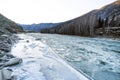 View blue and green river with snow and crushed ice during an ice drift in winter in the Altai mountains in Russia Royalty Free Stock Photo