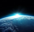 View of blue planet Earth with sun rising from space. Elements of this image furnished by NASA Royalty Free Stock Photo