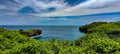 the view of the blue sea and the slightly cloudy sky