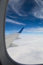 View of blue sky from airplane window during flight Royalty Free Stock Photo