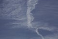 View of blue sky with interesting shapes of clouds and lines